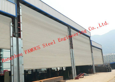 China Frequency Controlled Vertical Lifting Fabric Industrial Doors For Large Openings supplier