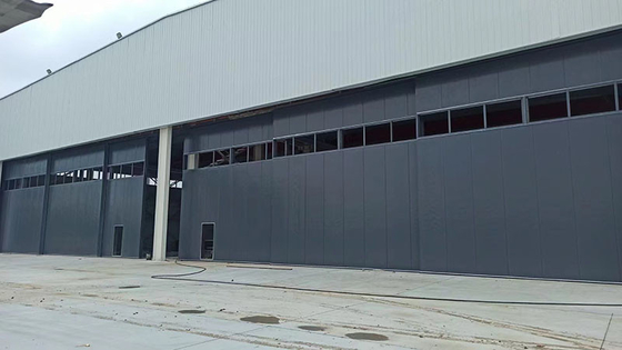 China Engineered Unidirectional Aeronautical Hangar Door Typical Design With Wicket supplier
