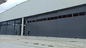 Engineered Unidirectional Aeronautical Hangar Door Typical Design With Wicket supplier