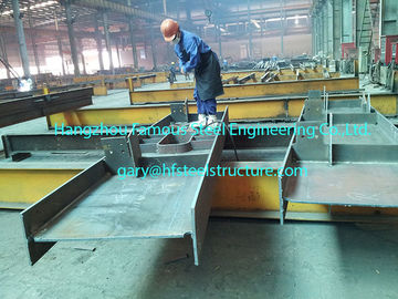 China Pre Engineering Commercial Steel Buildings H Section Beam Coated Grey Painting supplier