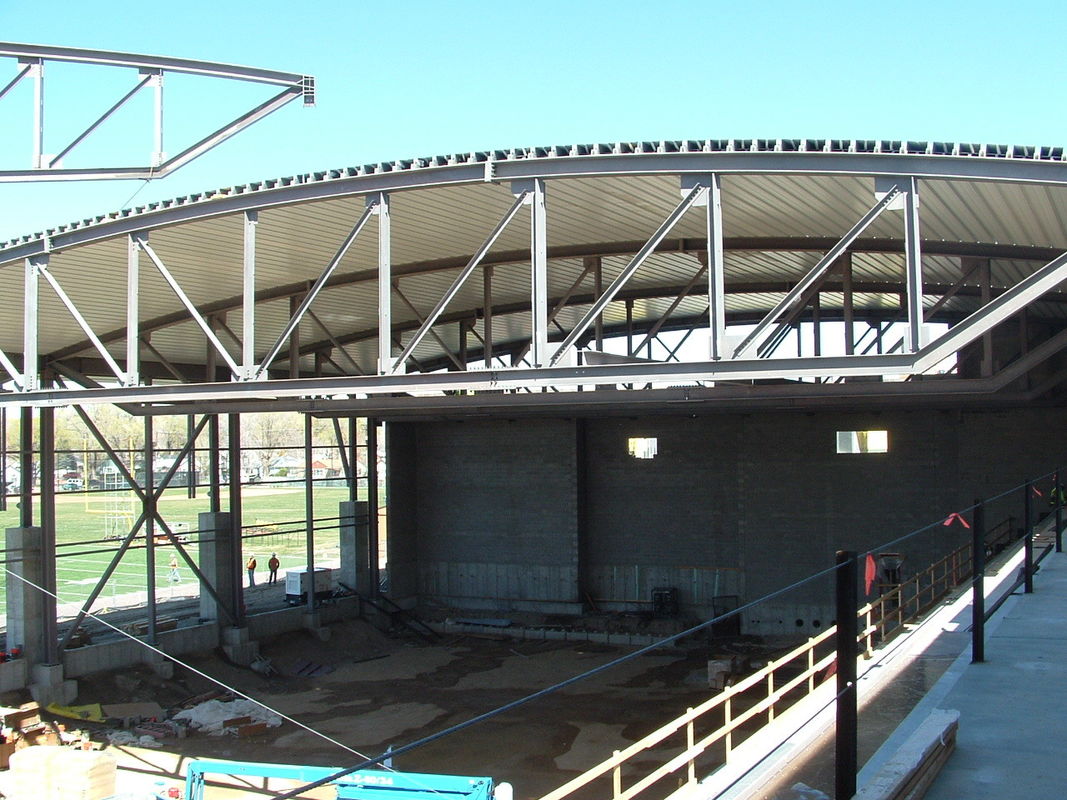 Innovative Half Suspended Structural Steel Fabrications Workshop Under Arc Shaped Roof Plate